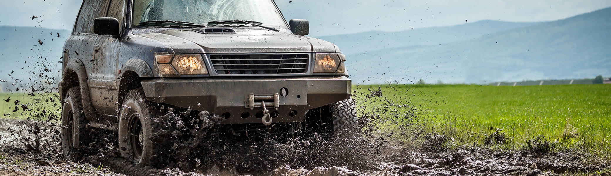 Truck splashing through the mud